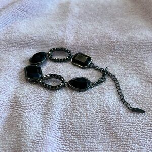 Bracelet, black beveled beads, surrounded by silver 2 rhinestone links named ext